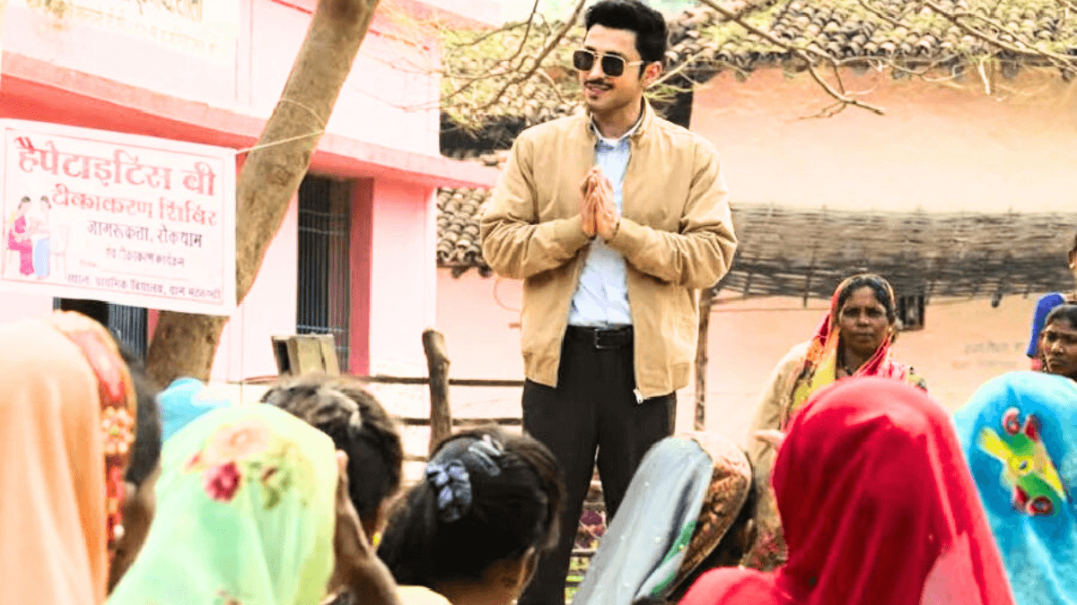 Gram Chikitsalay Web Series Review: Gram Chikitsalay Poster featuring Amol Parashar and Vinay Pathak in a rural backdrop with a broken hospital board and muddy road, representing the theme of village healthcare struggle