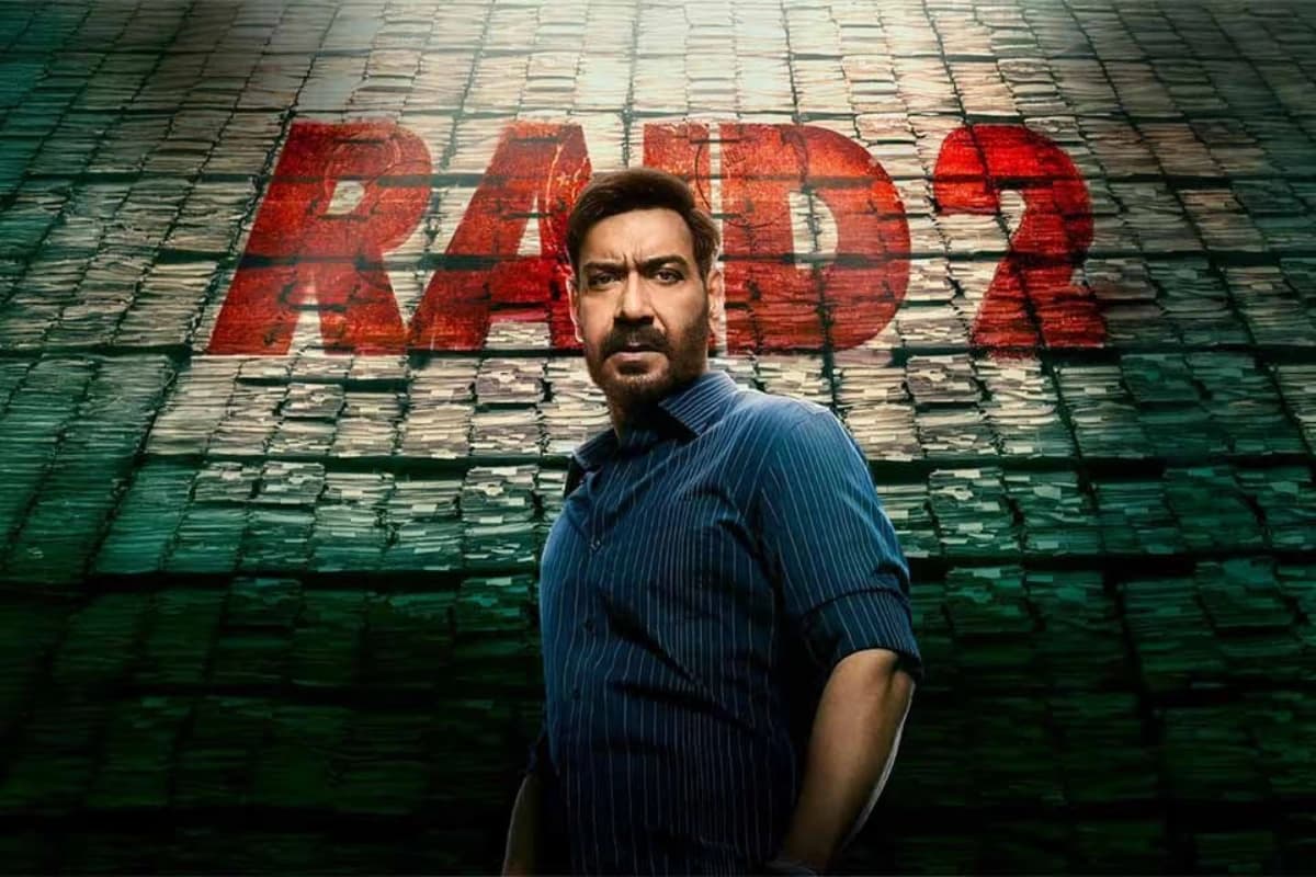 Raid 2 Movie still featuring Ajay Devgan and Ritesh Deshmukh in an intense scene from the 2025 Bollywood action thriller.