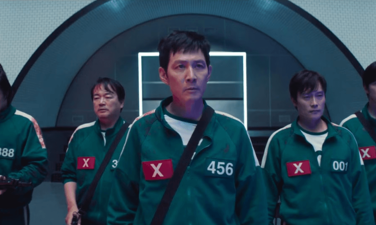 Squid Game Season 3 poster featuring main characters with dark and intense background, showcasing the deadly survival game theme