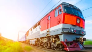 An Indian Train Stationed At A Platform With Passengers Boarding And Alighting, Representing The News About The Removal Of &Quot;Superfast&Quot; Status For Several Trains Due To Speed Reductions And Increased Stoppages.