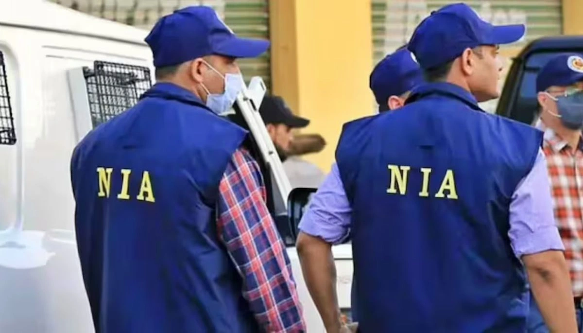 NIA officials conducting a raid at the residence of advocate Sandeep Kumar Sinha in Hajipur, Bihar, early morning with a cordoned-off area.