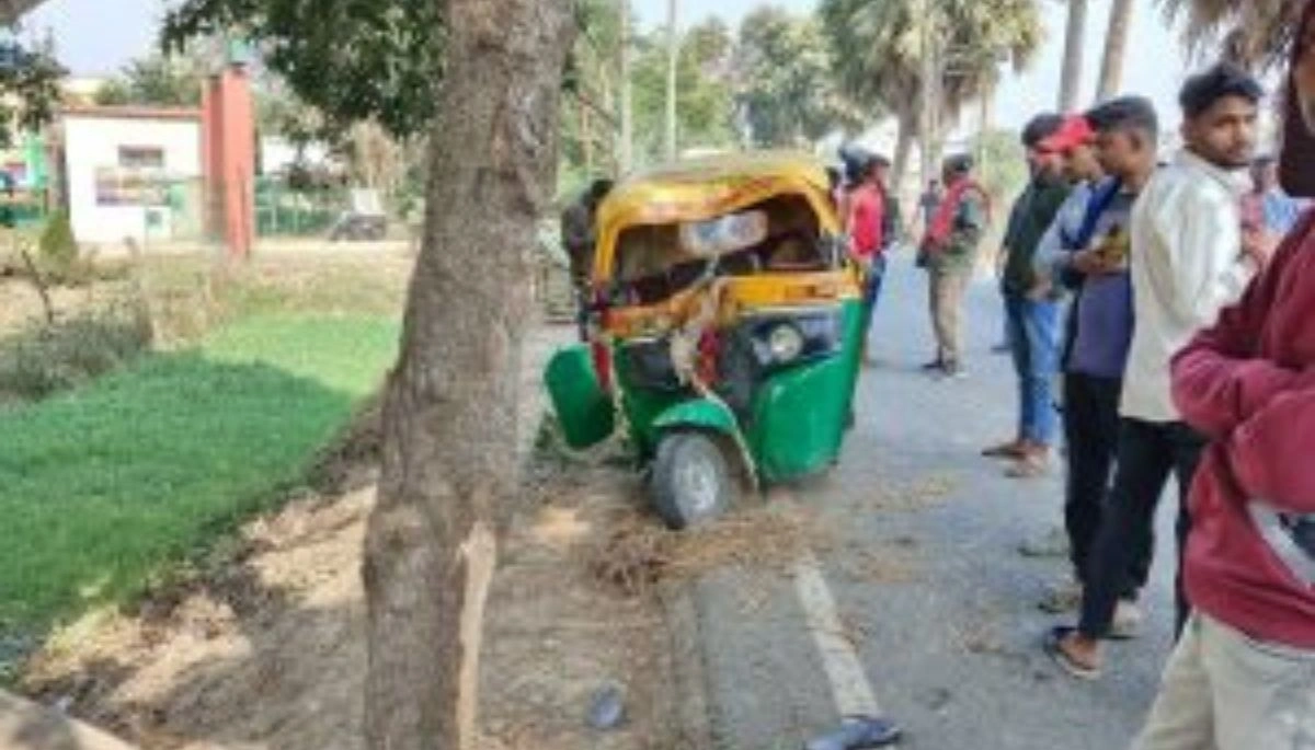 High-speed auto crashes into a tree in Saharsa, showing the damaged vehicle and locals gathered at the accident site.