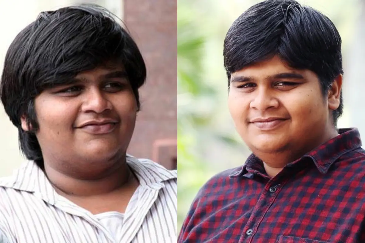 Karthik Subbaraj Net Worth जानकर उड़ जाएंगे होश – एक Software Engineer कैसे बना करोड़ों का Director! 7 Karthik Subbaraj smiling in front of movie posters with net worth and film success highlights in background